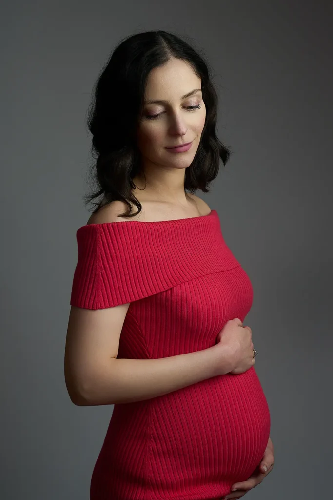 Maternity photoshoot in Mount Colah studio, pregnant woman in red dress
