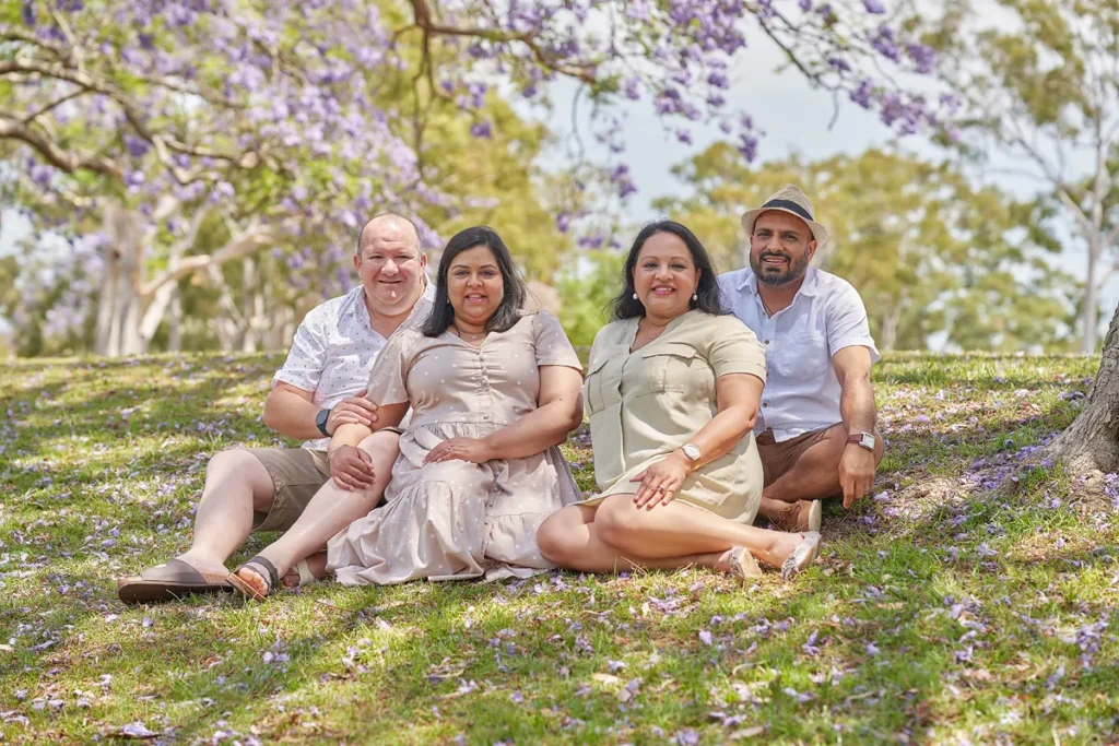 Extended family gathered closely on grass