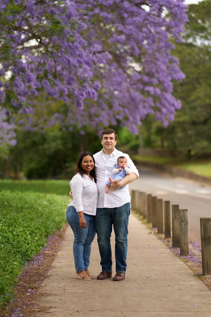 mum and dad walking with baby at Parramatta Park Sydney
