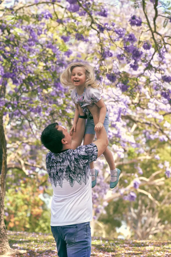 Father lifting daughter at Parramatta Park