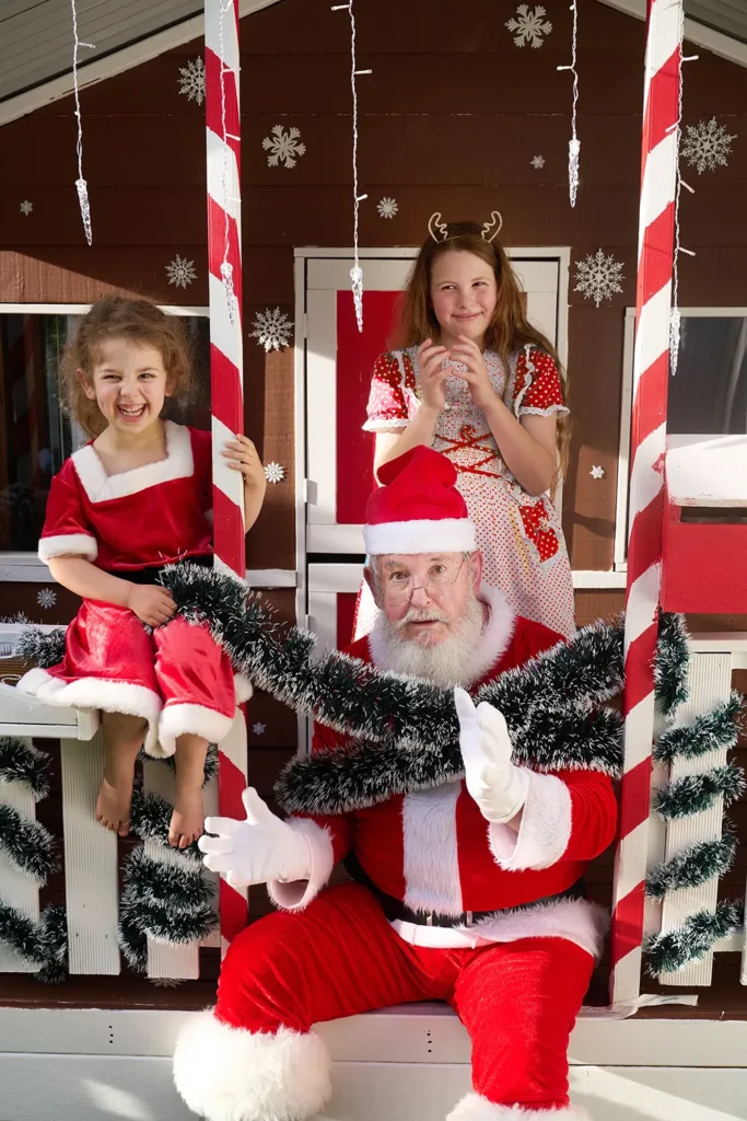 Funny photo with Santa and kids on porch railing in Hornsby Area